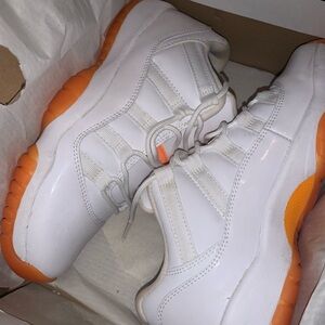 Jordan White and Orange Sneakers with Vibrant Sole and Breathable Upper